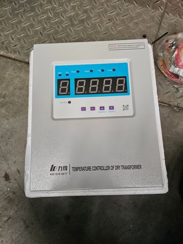 Temperature controller device for dry transformers with digital display and control buttons.