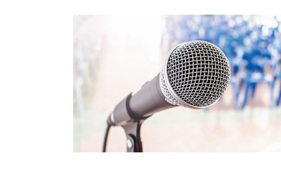 Close-up of a microphone ready for speaking or singing.