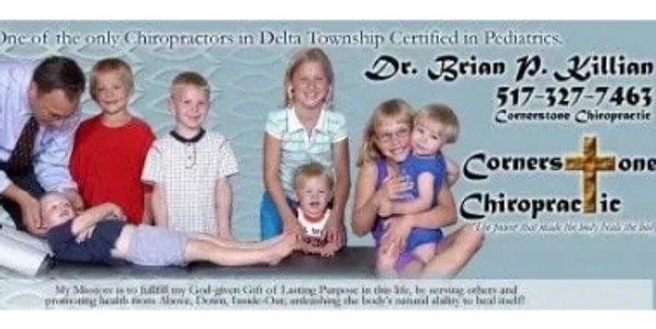 Dr. Killian adjusting and treating children