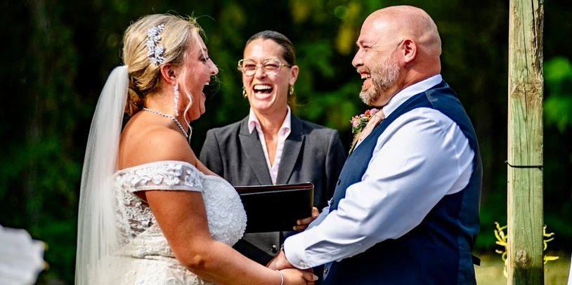 Cedar Rapids Iowa Wedding Officiant & Iowa Wedding Couple enjoy moment of laughter, fun Iowa wedding