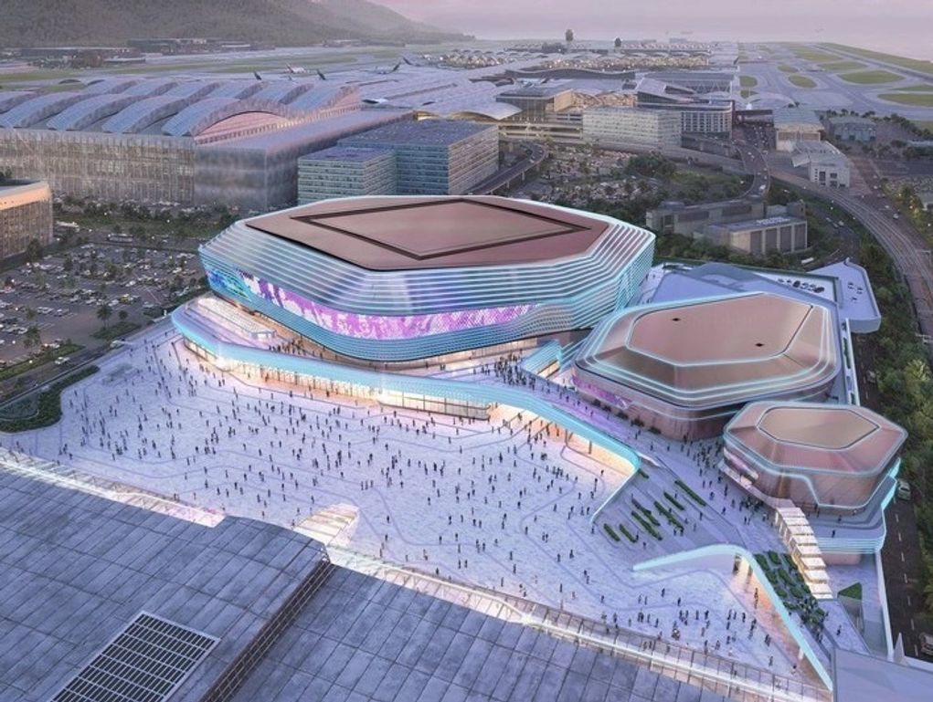 A futuristic architectural complex with large, uniquely shaped buildings and a spacious plaza.