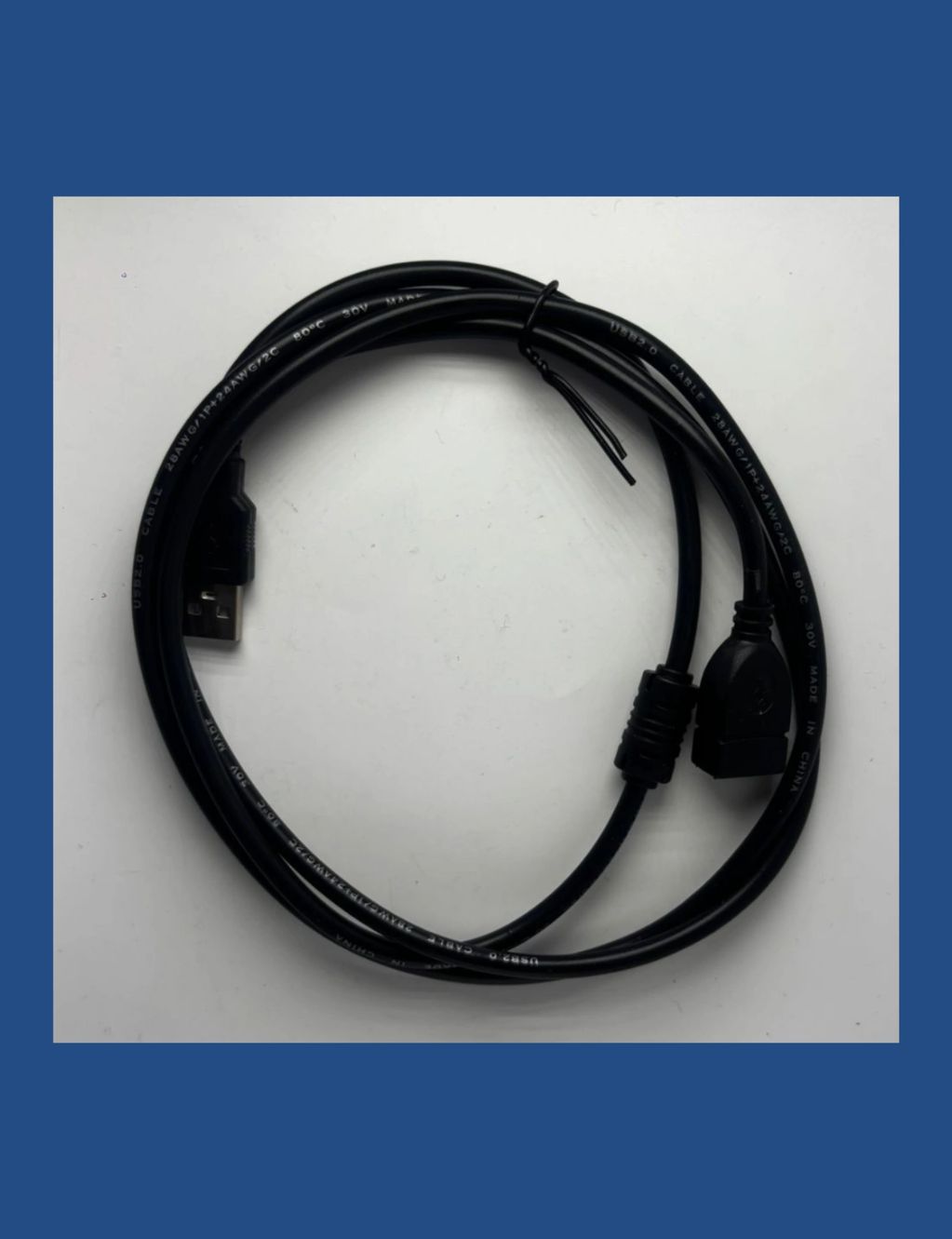 Black USB 2.0 cable coiled on a white surface.