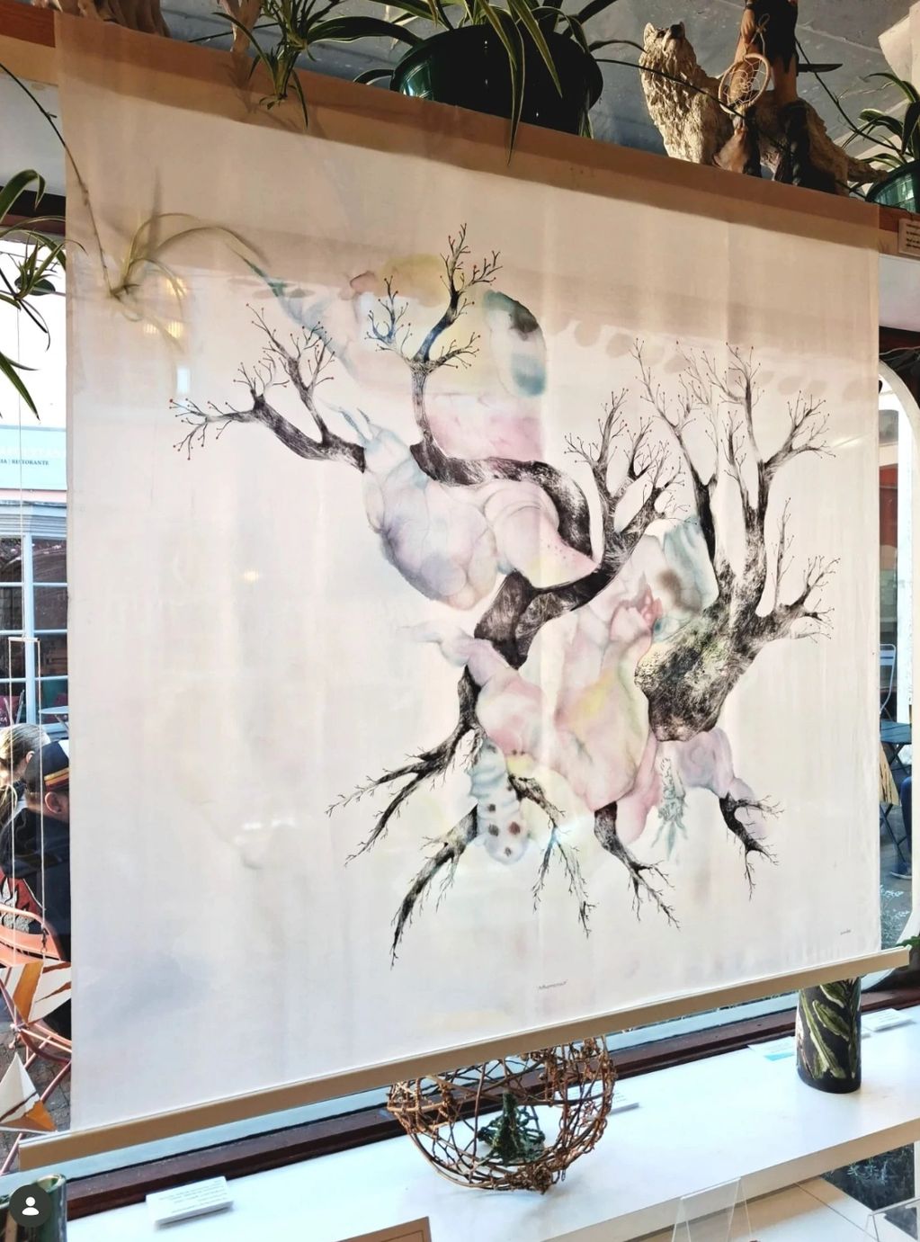 Artistic drawing of intertwined trees with an abstract background.