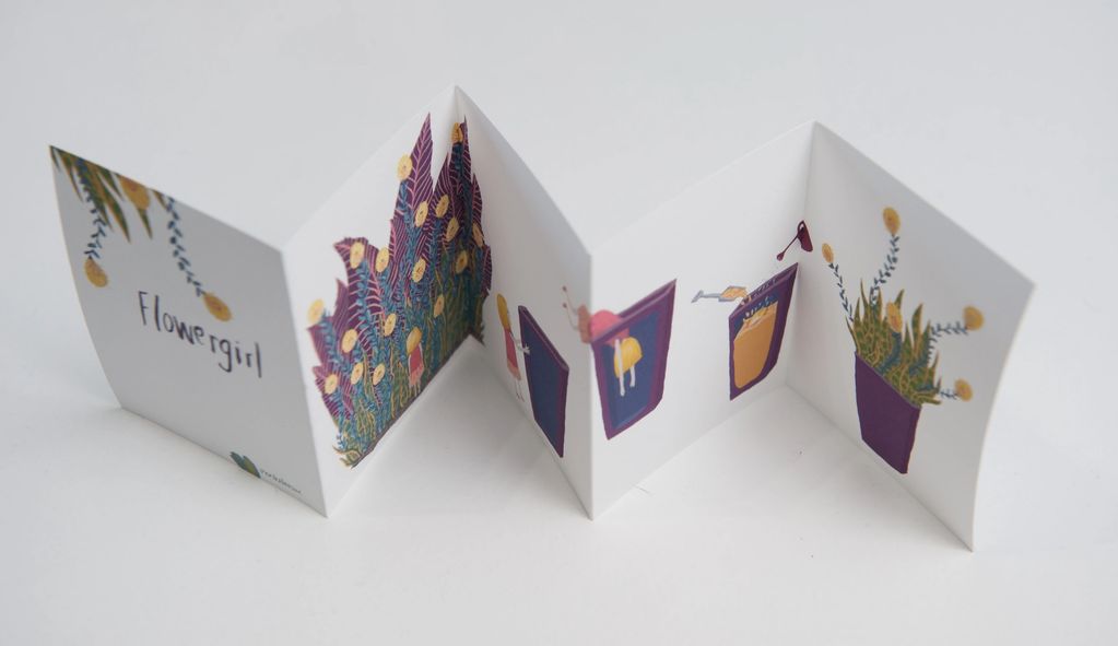 Accordion book titled 'Flower girl' with colorful illustrations.