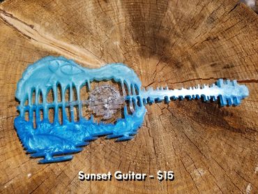 Sunset guitar silhouette $15 each
11.9" long x 5.3" tall