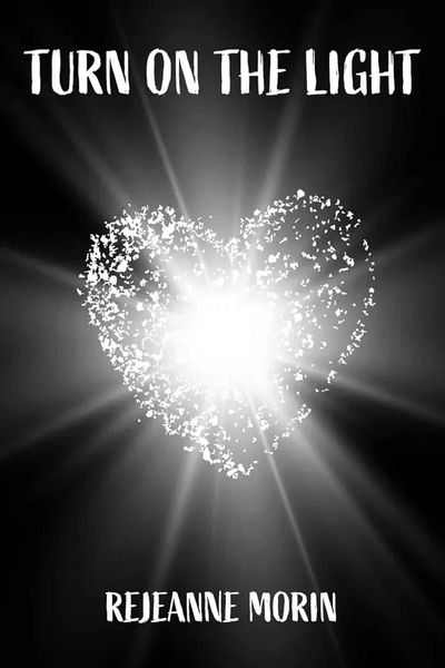 Black book cover with white heart and rays, title Turn on the Light and Writer's name Rejeanne Morin