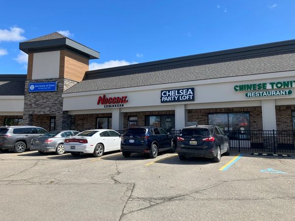 The convenient free parking lot available for guests right outside Chelsea Party Loft in Chelsea, MI