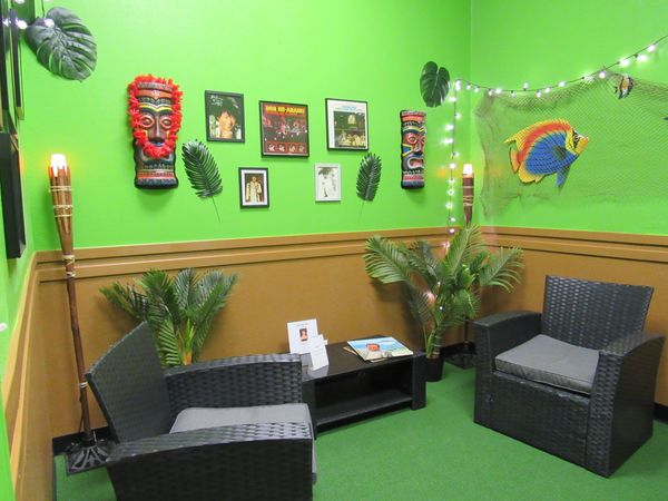 The vibrant, built-in VIP Tiki Lounge inside Chelsea Party Loft, in Chelsea, Michigan.