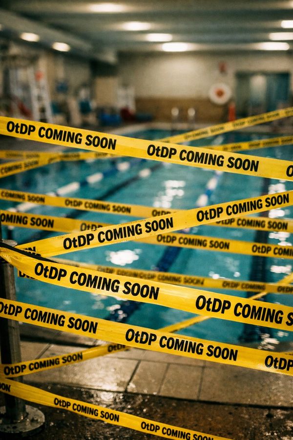 Indoor swimming pool blocked off with yellow tape reading 'OtDP COMING SOON'.