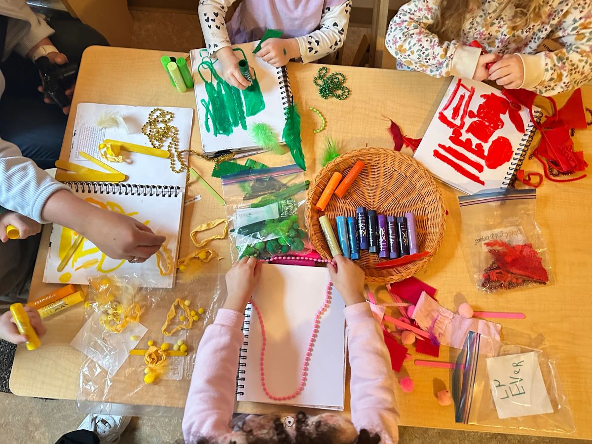 Children painting and crafting at Refugee and Immigrant Family Center, from its official site.