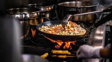 Authentic Thai cooking technique at Kin Dee Thai Cuisine—expertly prepared dishes using traditional 