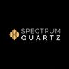 Logo for Spectrum Quartz with gold and white text on black background.