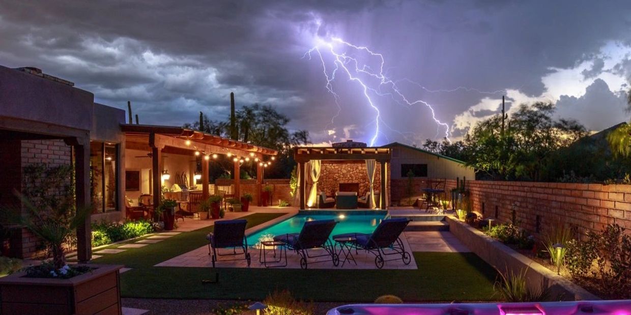 Back yard with turf, pavers and outdoor lighting