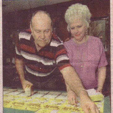 A couple looking at the boxes with games