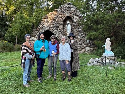 Women stand outside a shrine during a Useful Gatherings women's retreat near Buffalo NY
