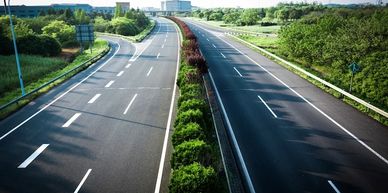 Empty multi-lane highway on a sunny day.
