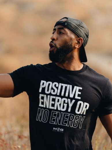 Man wearing a cap and a motivational t-shirt.