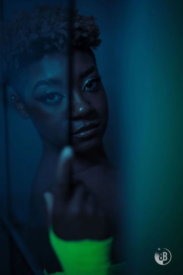 Portrait of a woman with artistic blue lighting.