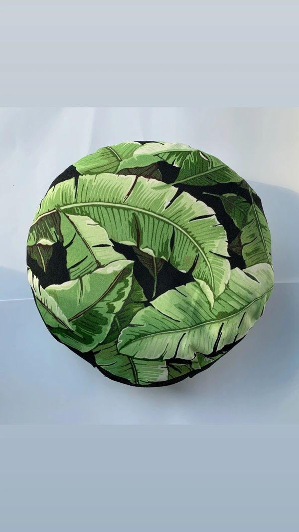 round pillow with tropical plant pattern 