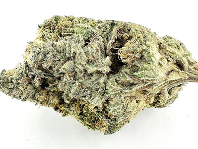Close-up of a dense cannabis bud with frosty trichomes.