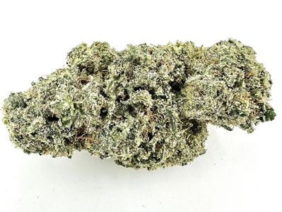 Close-up of a dense cannabis bud with trichomes.