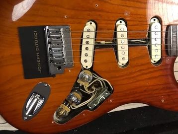 joseph ditucci card on a fender custom shop stratocaster body