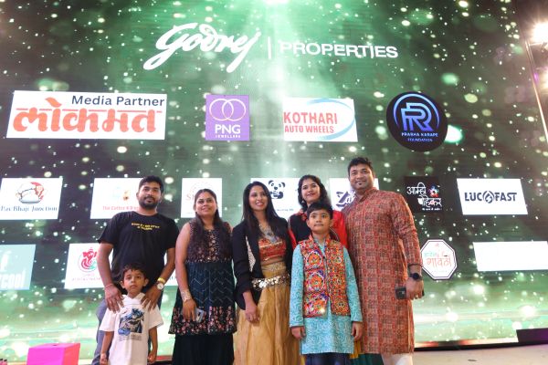 Group of people posing at a Godrej Properties event.
