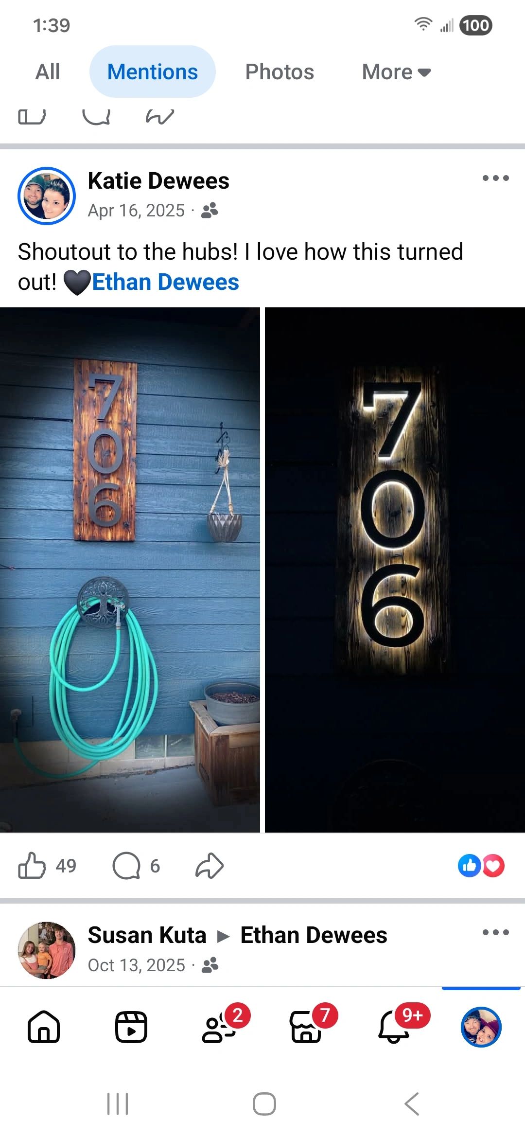 House number sign lit up at night.
