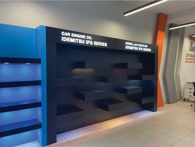 Empty display shelves for Idemitsu oil products.