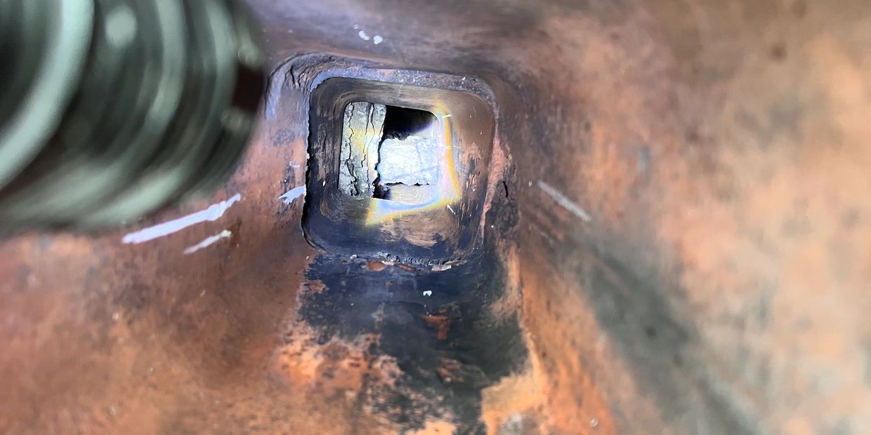 This is a picture of a chimney blockage on an oil chimney.