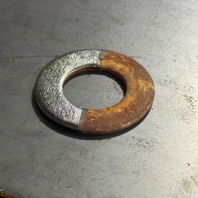 Rusty Washer Half cleaned by laser rust removal