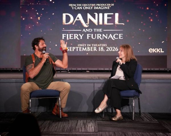 Two people discuss the movie 'Daniel and the Fiery Furnace' on stage.