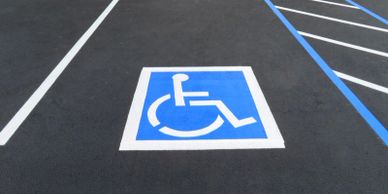 Parking lot with fresh sealcoating and new ADA compliant parking lot paint striping