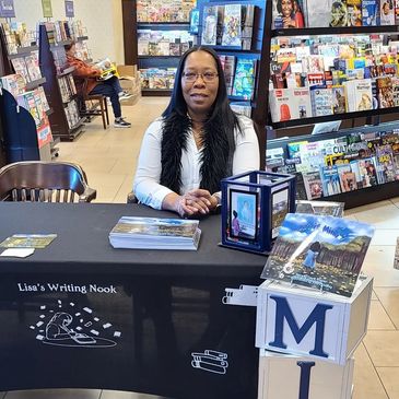 Woman at a book signing in a bookstore.
