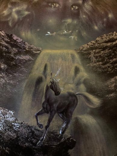 A mystical black unicorn gallops near a waterfall under a celestial face in the sky.