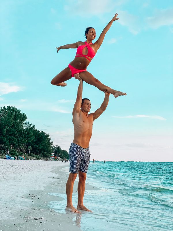 JD & Alexis Rappold.  Torch lift on beautiful caribbean beach. Adagio Pair ice skating team.