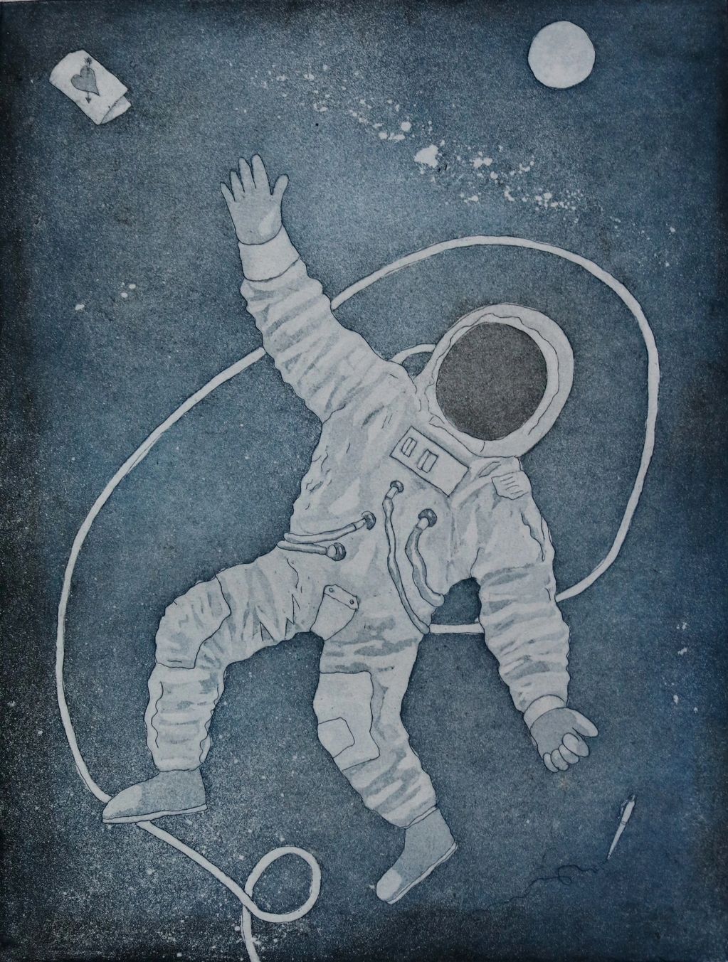 The image shows a moment of fun, an astronaut floats in space while a pen floats out of his hand as 