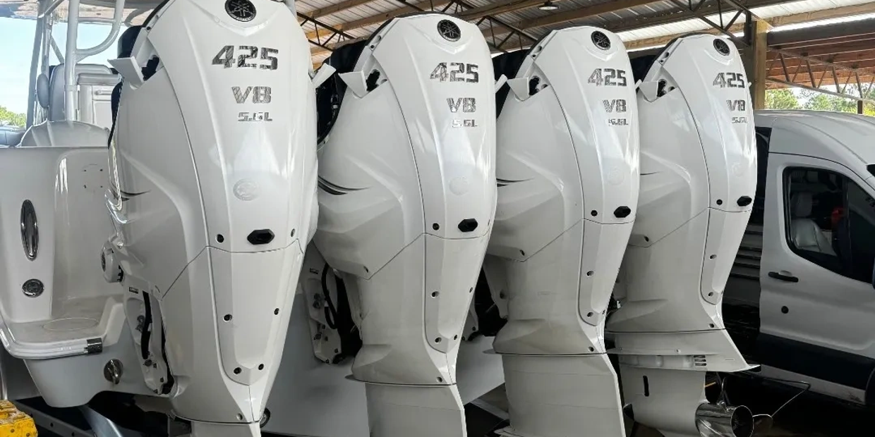 Four white Yamaha 425 V8 5.6L boat engines.