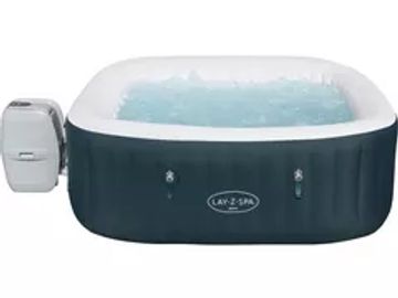Inflatable Lay-Z-Spa hot tub with water jets and control unit.