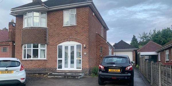 renovated house and two cars