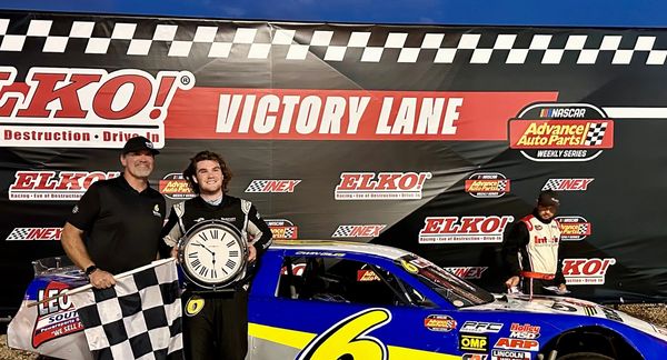 Owin holds his and his teams second Clock Trophy, next to his Dad (spotter), Darrin Giles, 8-17-24