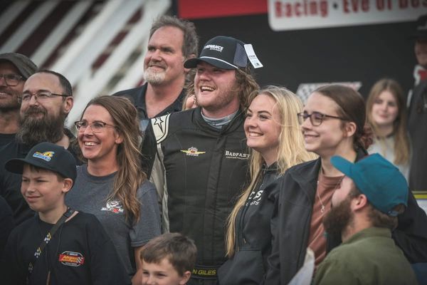 Owin celebrates "Advanced Auto Parts Night at the Races"win in victory lane with crew fans & family.