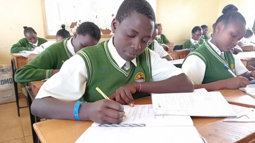In Kenya, school rules require girls' hair be very short or pulled into a tight bun.