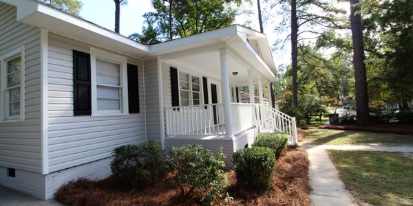 "Exterior of a distressed home purchased by Sell My Columbia House"