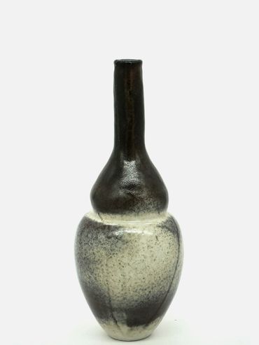 Tall ceramic vase with a black and white gradient finish.