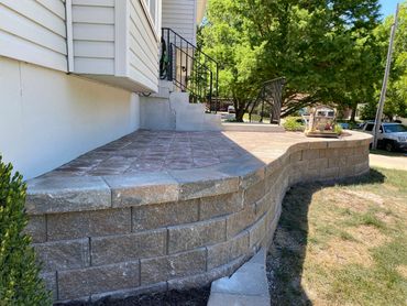 beautiful wall with a nice patio to look out of the front yard with out taking much space