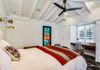 queen bedroom with built-in desk area
