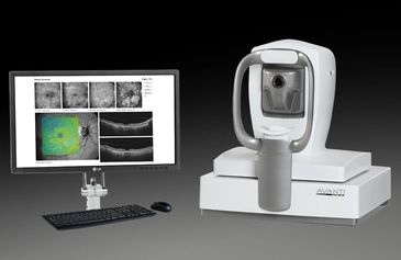 Advanced eye scanning device with detailed retinal imaging on a monitor.