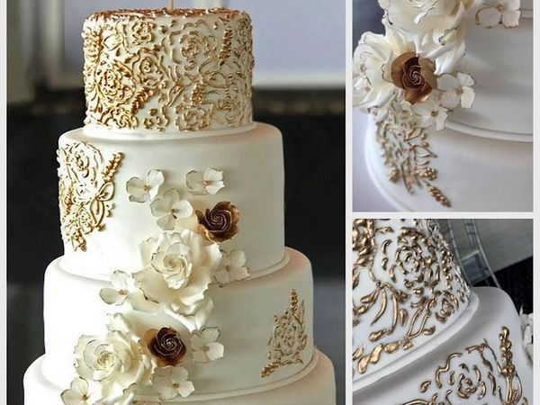 Elegant sugar flowers embellish this  fondant coverered cake wiith edible gold piping. 