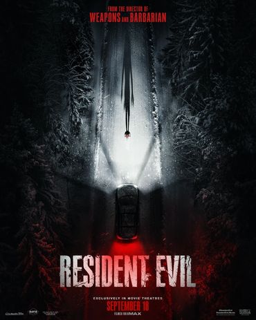 Dark snowy road with a car and a lone figure, poster for Resident Evil movie.